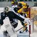 Michigan senior center Kevin Lynch fights off Michigan State defenders on Friday. Daniel Brenner I AnnArbor.com